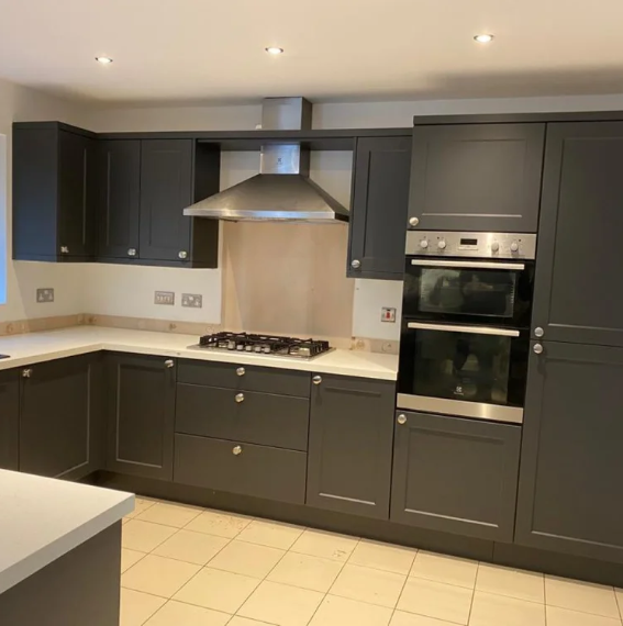 Charcoal shaker kitchen with integrated double oven and gas hob, fitted by JL Kitchens & Bedrooms