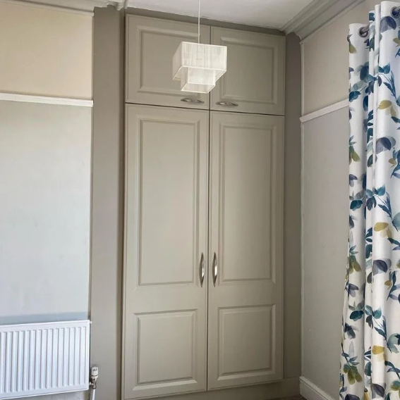 Fitted wardrobe with taupe shaker doors, fitted by JL Kitchens & Bedrooms