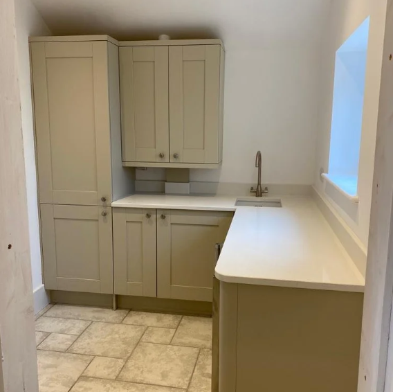 Fitted utility room cabinetry with taupe shaker doors, fitted by JL Kitchens & Bedrooms