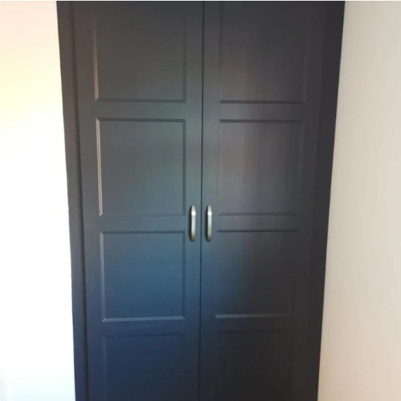 Fitted wardrobe with charcoal panelled doors and brushed nickel handles, fitted by JL Kitchens & Bedrooms